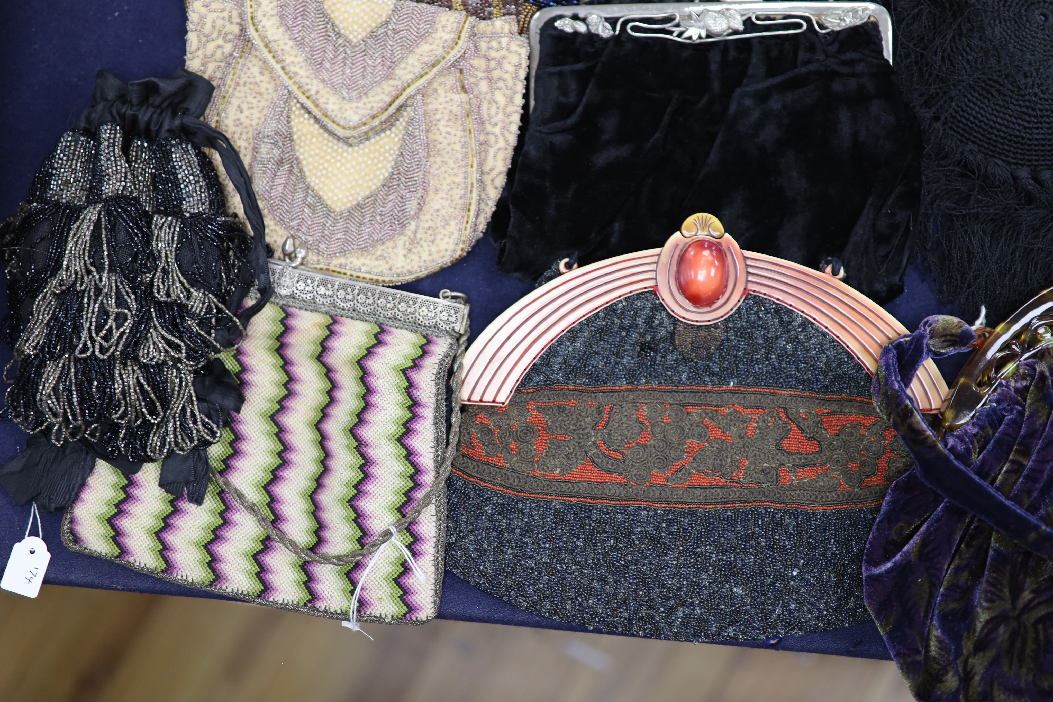 A collection of approximately fifty Victorian and later beadwork, white metal and fabric purses etc.